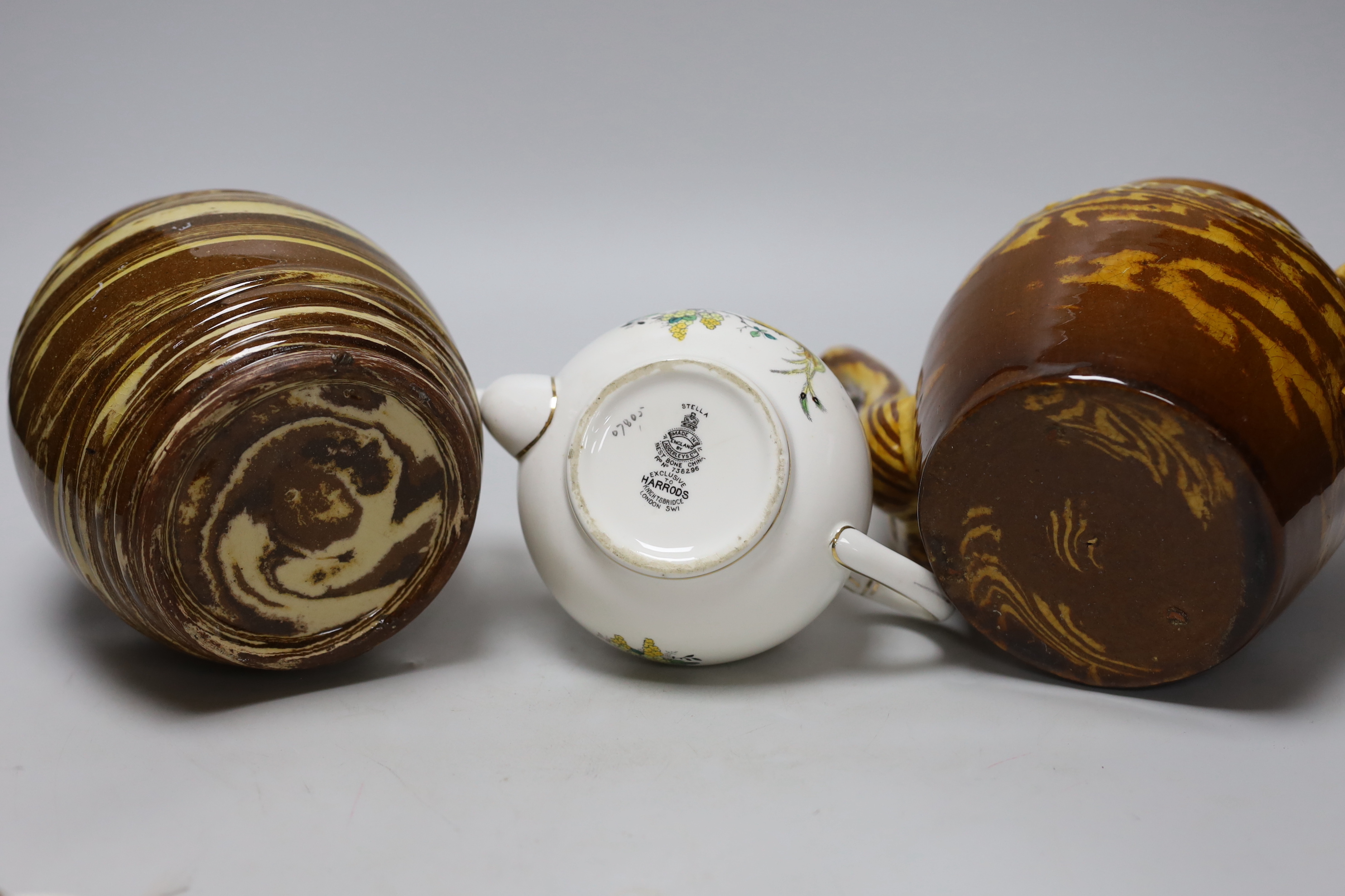 Two 19th century and later teapots including and a Harrods Stella example lidded pottery sugar jar dated 1888, the largest 20cm high